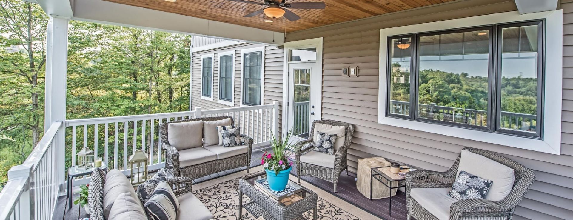 custom home grey porch with patio furniture