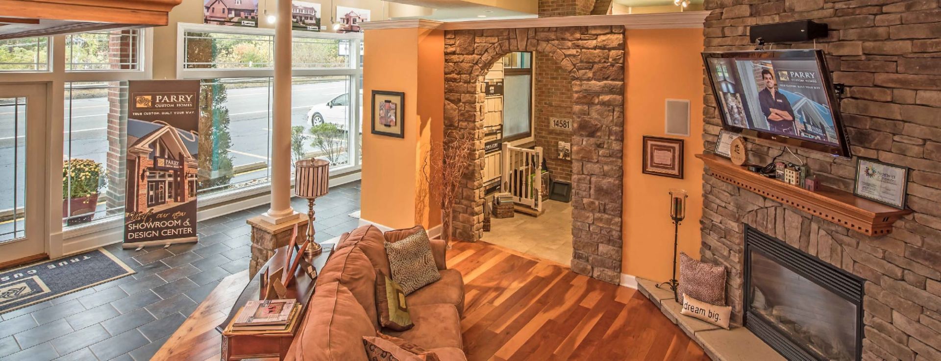 custom living room orange walls and wood floor